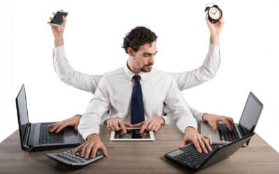 Businessman stressed by too many tasks in the office