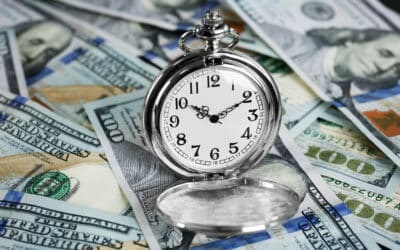 Time is money. Pocket watch and dollars bills