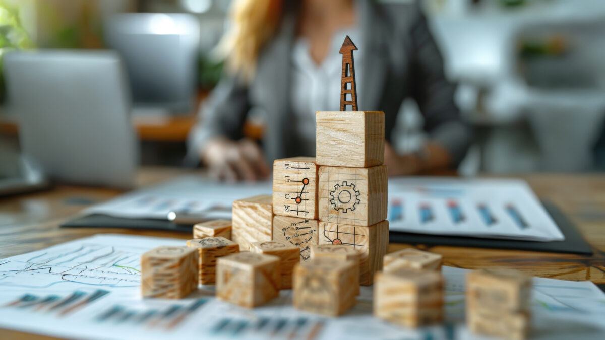 wooden blocks of small improvements creating progress