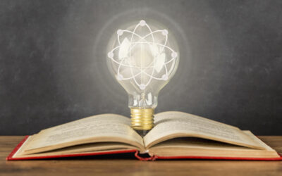 Book and a light bulb. Close-up idea concept