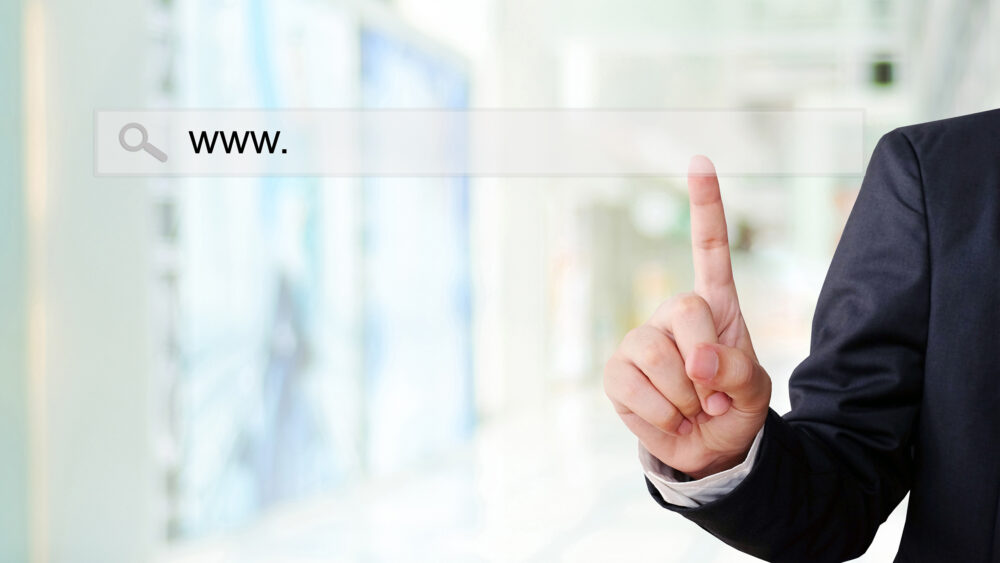 Businessman hand touching address bar