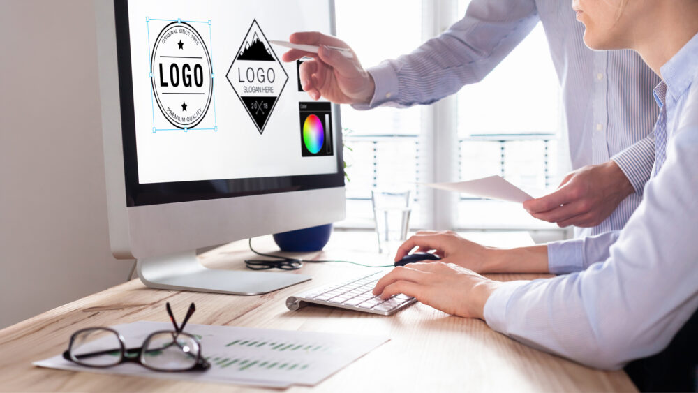 Graphic designer drawing logo sketches