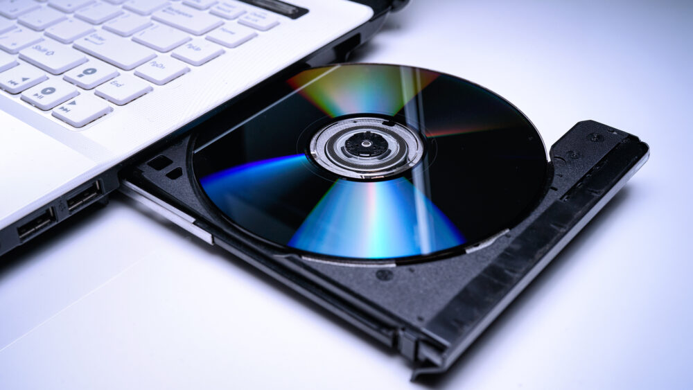 High angle view of compact disc in laptop cd player