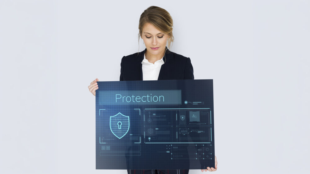 Woman holding cybersecurity banner